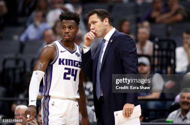 Head coach Luke Walton of the Sacramento Kings talks to Buddy Hield during their game against the Melbourne United at Golden 1 Center on October 16,...