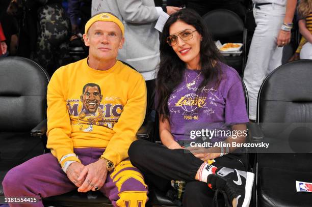 Musician Flea of Red Hot Chili Peppers attends a basketball game between the Los Angeles Lakers and the Golden State Warriors at Staples Center on...