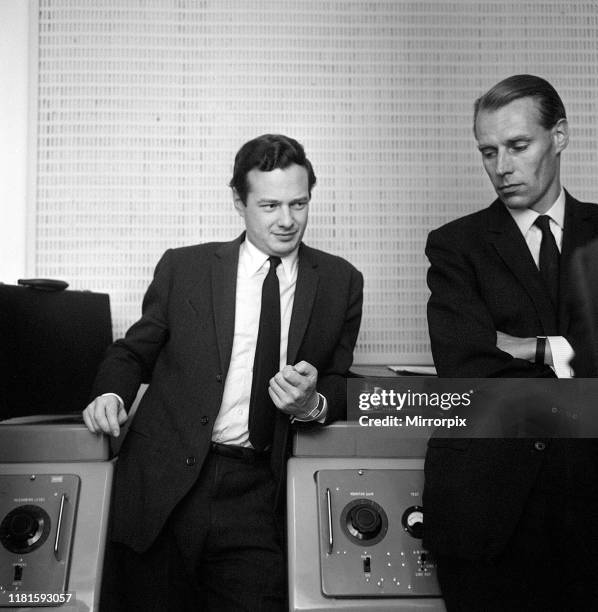 The Beatles manager Brian Epstein taken at the EMI Studios at Abbey Road St John's Wood seen with the group's recording producer George Martin....