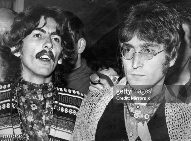 George Harrison and John Lennon of The Beatles talking to the press and media at Bangor following the news of the death of their manager Brian...