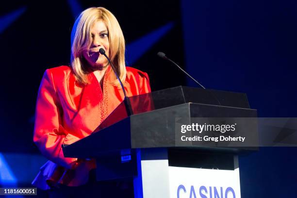 Singer/songwriter Claudette Rogers Robinson introduces singer Martha Reeves, recipient of the Casino Entertainment Legend Award, at the Global Gaming...