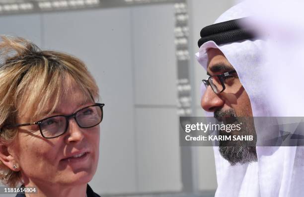 Sheikh Khaled bin Mohammed bin Zayed al-Nahyan welcomes Claude Chirac, late Jacques Chirac's daughter, at the Louvre in Abu Dhabi on November 11,...