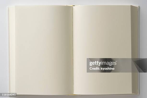isolated shot of opened blank white book on white backgrounds - los stockfoto's en -beelden