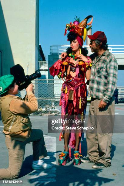 An unidentified camera operator films American actors Carol Burnett and Alan Arkin as they pose, in costume for their film 'Chu Chu and the Philly...
