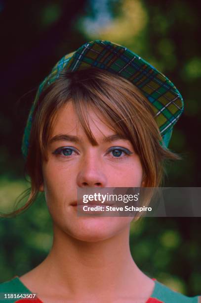 Portrait of French singer and actress Francoise Hardy, in a green, plaid cap, as she poses outdoors, Venice, Italy, 1966.