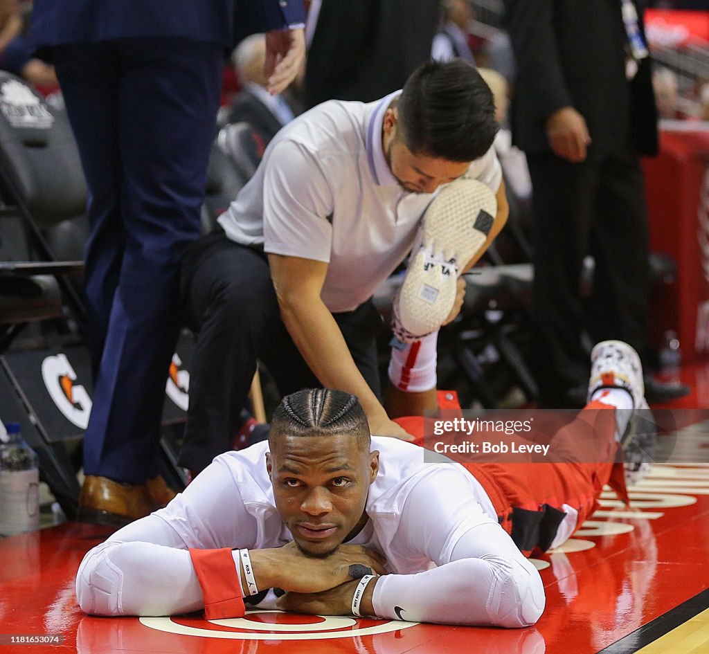 Russell Rockets Basketball Russell Westbrook of the Houston Rockets is stretched by a trainer ...