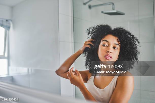 no pimples detected so far - black woman curly hair stock pictures, royalty-free photos & images