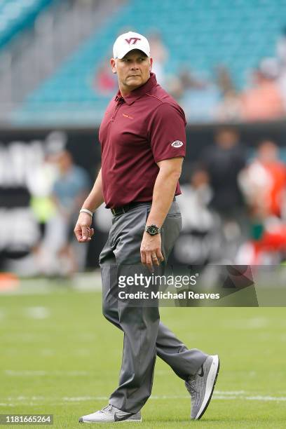 Head coach Justin Fuente of the Virginia Tech Hokies looks on prior to the game against the Miami Hurricanes at Hard Rock Stadium on October 05, 2019...