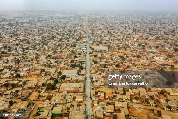 populated city townships of luanda, aerial view - africa road stock pictures, royalty-free photos & images