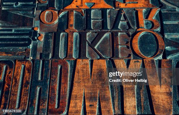 antique wooden letterpress printing blocks in abstract pattern - printing block stock pictures, royalty-free photos & images