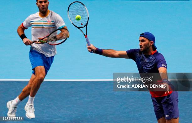Netherlands' Jean-Julien Rojer and Romania's Horia Tecau return against Germany's Kevin Krawietz and Germany's Andreas Mies during their men's...