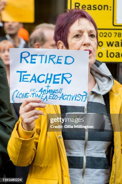 An Extinction Rebellion environmental activist and Retired Teacher protests outside the offices of The Department of Working Pensions on October 17,...