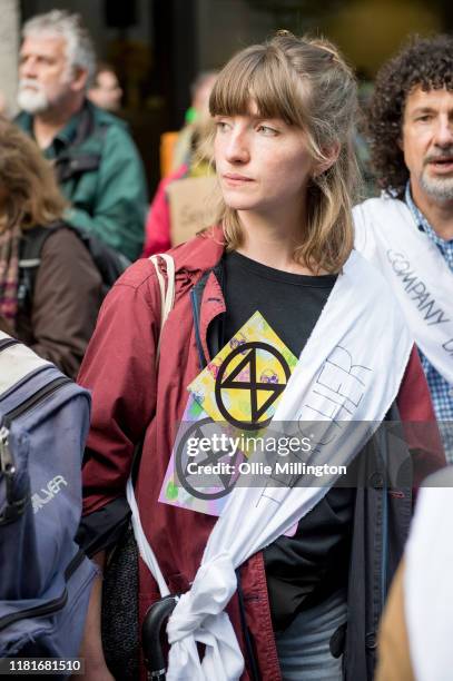 An Extinction Rebellion environmental activist and Teacher protests outside the offices of The Department of Working Pensions on October 17, 2019 in...