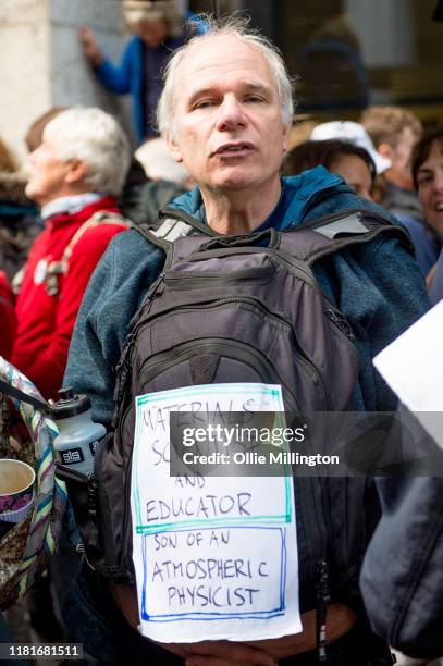 An Extinction Rebellion environmental activist and Materials Scientist and Educator protests outside the offices of The Department of Working...