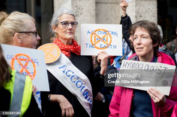 An Extinction Rebellion environmental activists protests outside the offices of The Department of Working Pensions during a gathering where they...