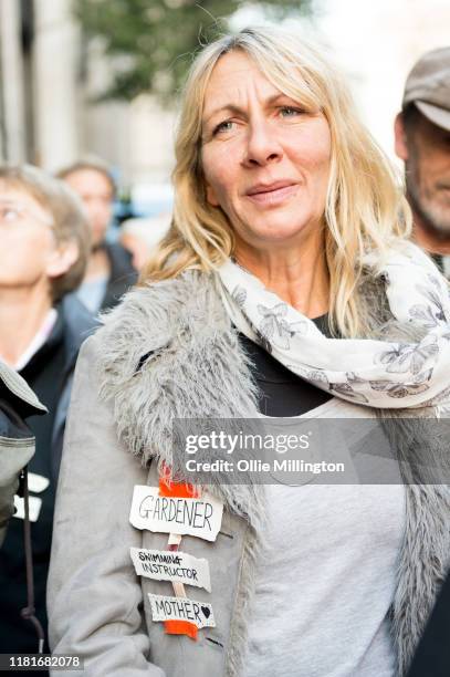 An Extinction Rebellion environmental activist and Gardener protests outside the offices of The Department of Working Pensions on October 17, 2019 in...