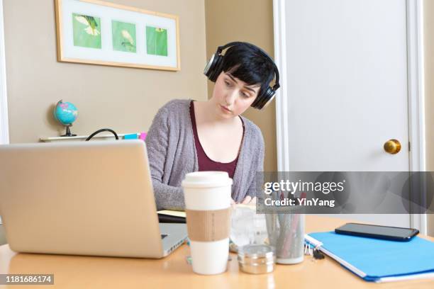 millennial young woman working in home office telecommuting - transcrição imagens e fotografias de stock