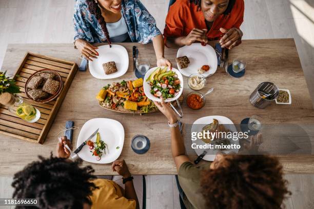 food is the best excuse to get together - dining table stock pictures, royalty-free photos & images