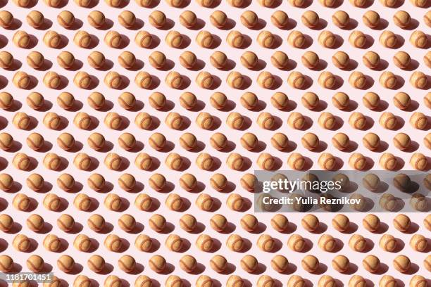 repeated baseball ball on the pink background - pink baseball stock pictures, royalty-free photos & images