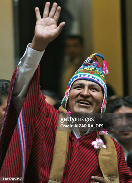 Bolivian President Evo Morales, wearing a traditional "lluchu", waves in his 47 anniversary at the Palacio Quemado, 26 October 2006, during a...