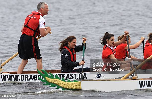 Catherine, Duchess of Cambridge rows in a dragon boat across Dalvay lake on July 4, 2011 in Charlottetown, Canada. The newly married Royal Couple are...