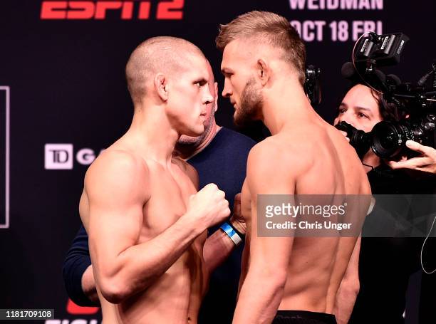 Opponents Joe Lauzon and Jonathan Pearce face off during the UFC weigh-in during the UFC weigh-in at Orpheum Theatre on October 17, 2019 in Boston,...