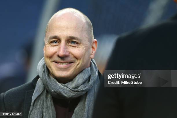 New York Yankees General Manager Brian Cashman looks on during batting practice prior to game four of the American League Championship Series against...