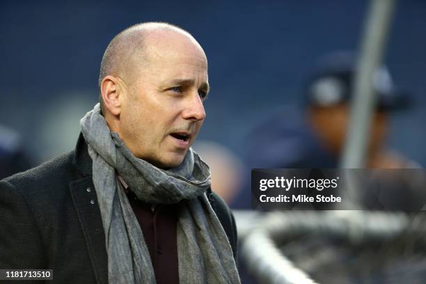 New York Yankees General Manager Brian Cashman looks on during batting practice prior to game four of the American League Championship Series against...