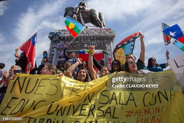 Teachers protest with Chilean and Mapuche indigenous flags in Santiago on the fourth week of protests against the government of Chilean President...