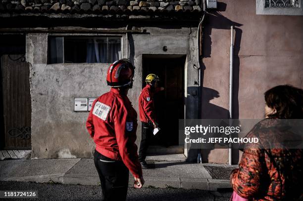 Firefighters check houses in Le Teil, southeastern France, on November 11 after an earthquake with a magnitude of 5.4 hit the area. - An unusually...