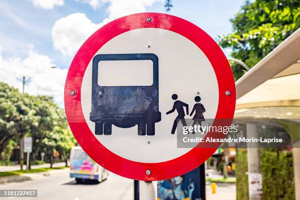 road sign indicating a bus stop - colombia street stock pictures, royalty-free photos & images