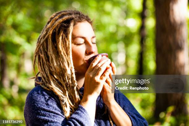 woman drinking ceremonial plant medicine - new age stock pictures, royalty-free photos & images