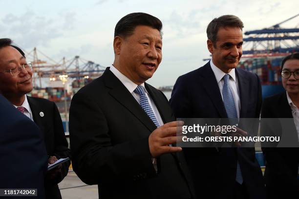 President of the Republic of China Xi Jinping and Greek Prime Minister Kyriakos Mitsotakis visit the cargo terminal of Chinese company Cosco in the...