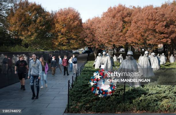Visitors to the Korean War Memorial are seen on Veterans Day on November 11, 2019 in Washington, DC.