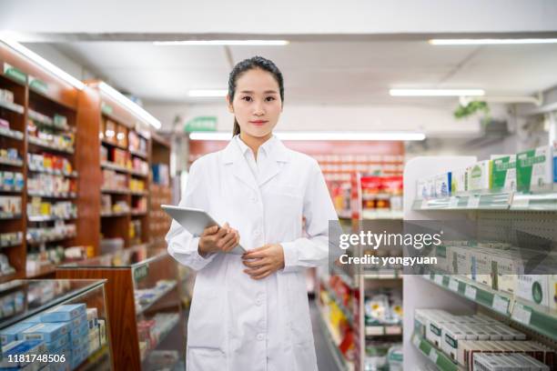 portrait of a female pharmacist - chinese scientist stock pictures, royalty-free photos & images