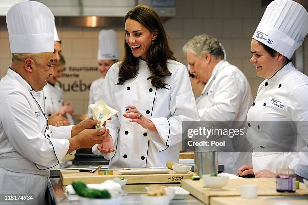 Catherine, Duchess of Cambridge takes part in a cooking workshop at the Institut De Tourisme et D'hotellerie Du Quebec on July 2, 2011 in Montreal,...