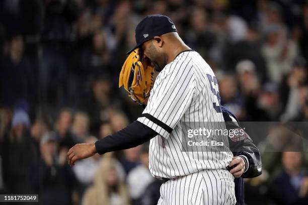 Sabathia of the New York Yankees walks off the field as he comes out of the game against the Houston Astros during the eighth inning in game four of...