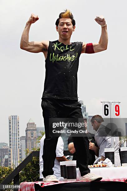 Competitive eater Takeru Kobayashi challeges 2011 Nathan's Famous Hot Dog Eating Competition Contestants via satellite at 230 Fifth Avenue on July 4,...