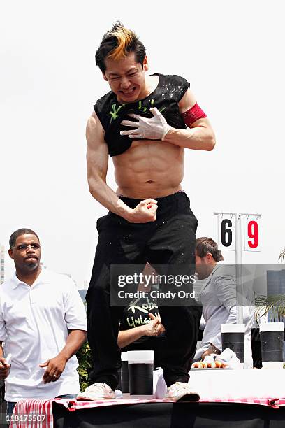 Competitive eater Takeru Kobayashi challeges 2011 Nathan's Famous Hot Dog Eating Competition Contestants via satellite at 230 Fifth Avenue on July 4,...