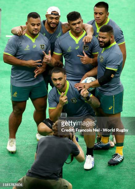 Players of Australia pose for a picture during the Australia Captain's Run ahead of their Quarter-final match against England at Oita Stadium on...