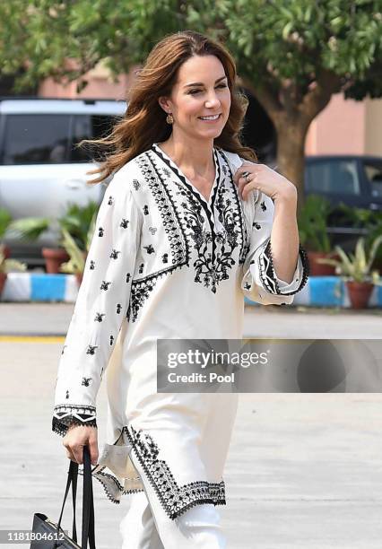 Catherine, Duchess of Cambridge arrives at Lahore airport with Prince William, Duke of Cambridge to take their flight back to Islamabad during their...