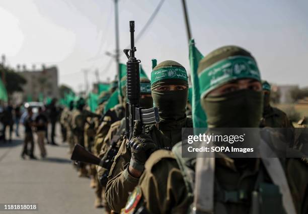 Hamas activists are seen during a military demonstration against Israel in the southern Gaza Strip. Izz el-Deen al-Qassam Brigades, the armed wing of...