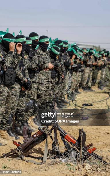 Palestinian Hamas militants pray during an anti-Israel military show in the southern Gaza Strip. Izz el-Deen al-Qassam Brigades, the armed wing of...