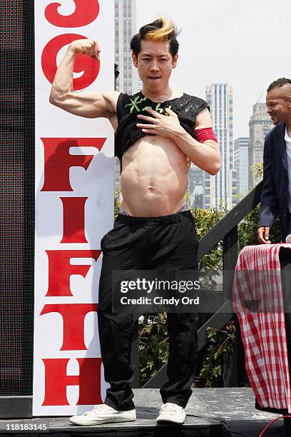 Competitive eater Takeru Kobayashi poses after he challeged 2011 Nathan's Famous Hot Dog Eating Competition Contestants via satellite at 230 Fifth...