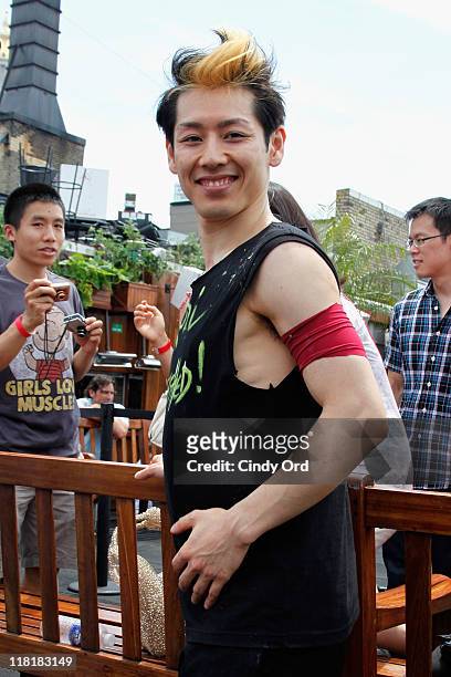 Competitive eater Takeru Kobayashi challeges 2011 Nathan's Famous Hot Dog Eating Competition Contestants via satellite at 230 Fifth Avenue on July 4,...