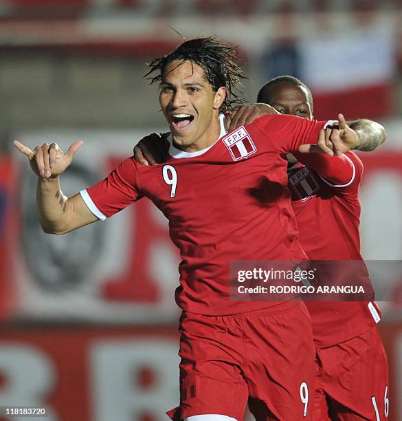 Peruvian forward Paolo Guerrero celebrates after opening the score against Uruguay during their 2011 Copa America Group C first round football match,...