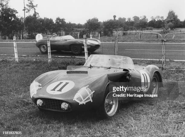 Le Mans, Hawthorn's Jaguar D type passes de Portago's stricken Ferrari. Creator: Unknown.
