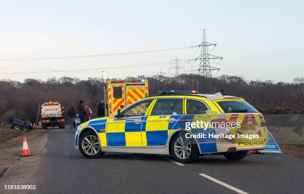 Police car and ambulance attending road traffic accident 2018. Creator: Unknown.