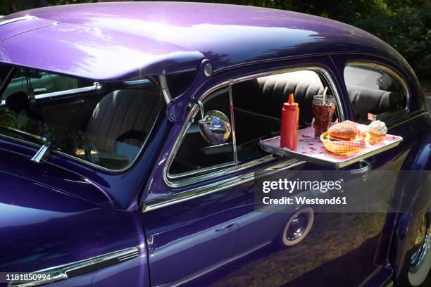 typical american fast food on tray at vintage car, chevrolet fleetline - maquina coca cola stock pictures, royalty-free photos & images