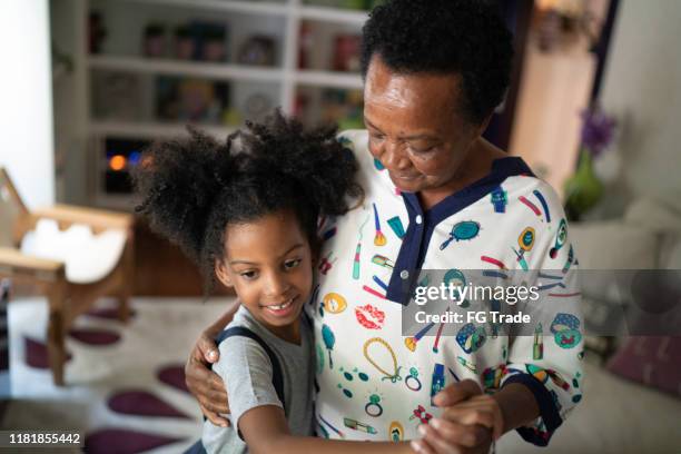 grand daugther and grandmother dancing at living room - free pictures ballroom dancing stock pictures, royalty-free photos & images
